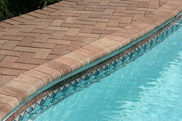 brick pool edge in the summer